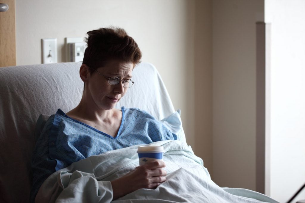 Preventing Drug Addiction in Cancer Patients 2 depressed short haired woman on hospital bed